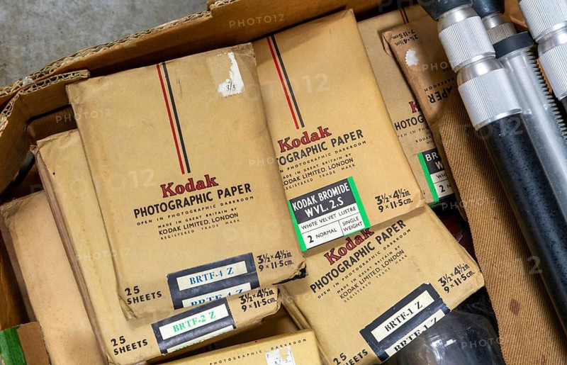 Old Kodak photographic paper packages on display in auction room