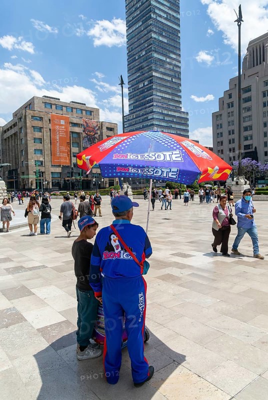 Man and boy selling ice creams near Bellas Artes