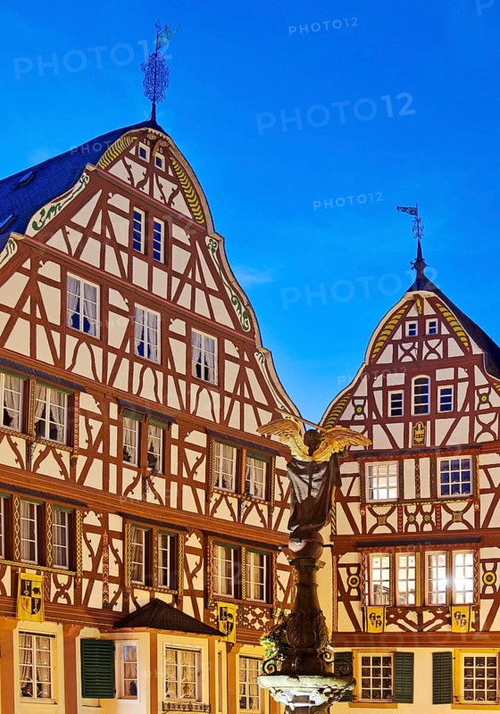 Gabled half-timbered houses on the medieval market square in the evening