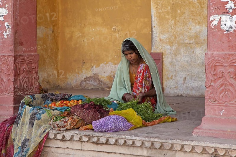 Indian women dressed in sari selling vegetables in the town Bundi