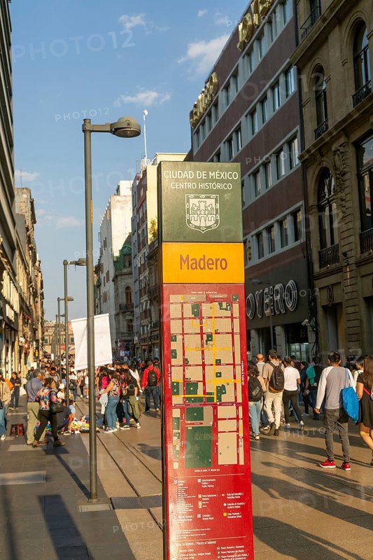 Crowd of people on pedestrianised street Avenida Madero