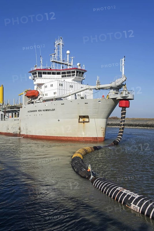 Trailing suction hopper dredger Alexander von Humboldt in port of Ostend discharging sand via long hoses