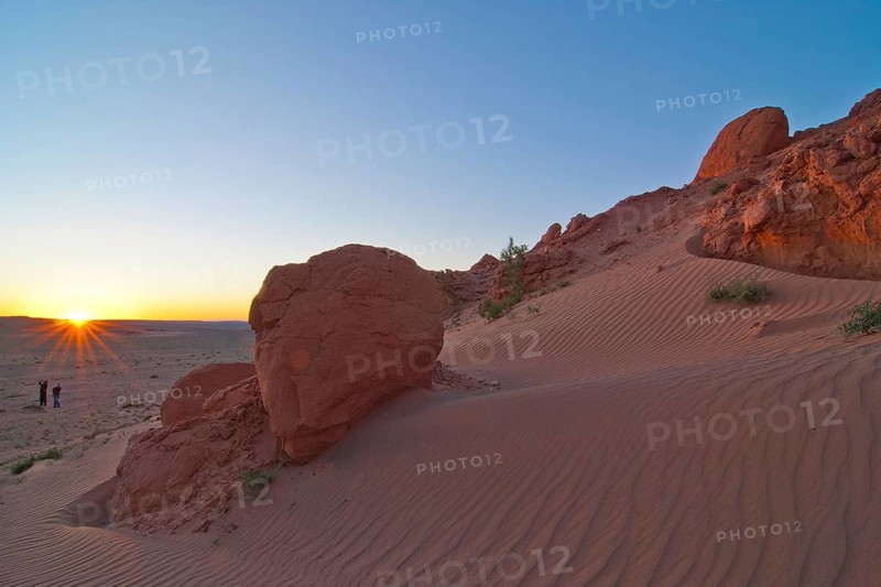 Landcruiser in the last evening light in front of the Flaming Cliffs