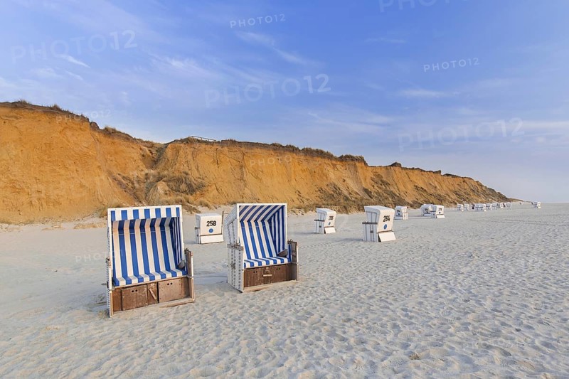 Roofed wicker beach chairs at the Rotes Kliff