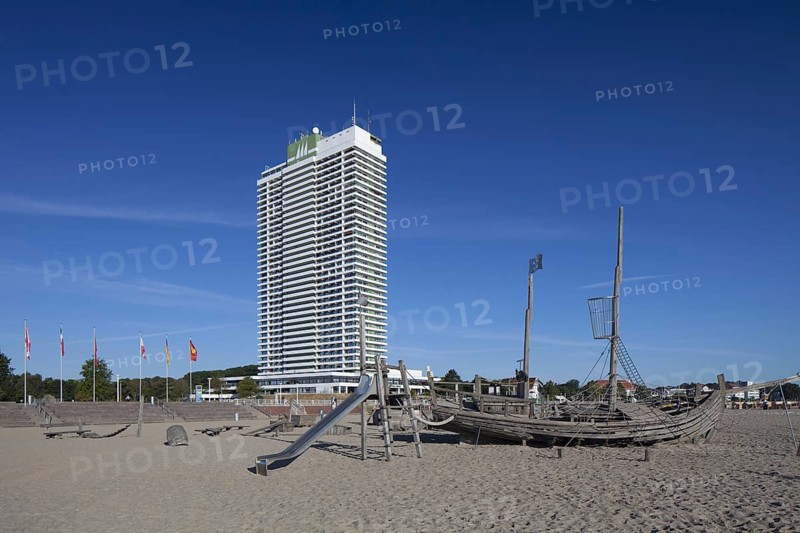 The Maritim Hotel and wooden pirate boat in playground on beach at Travemuende