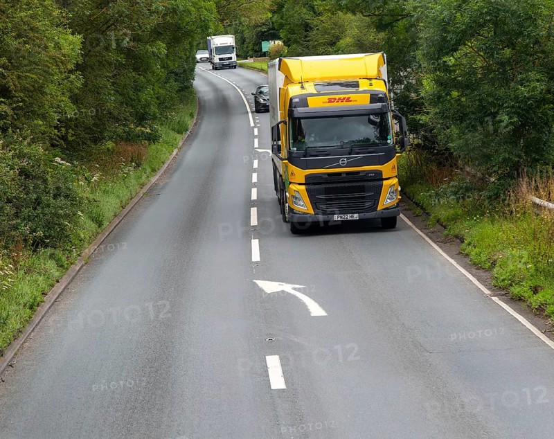 DHL truck lorry heavy goods delivery vehicle on A346 main road