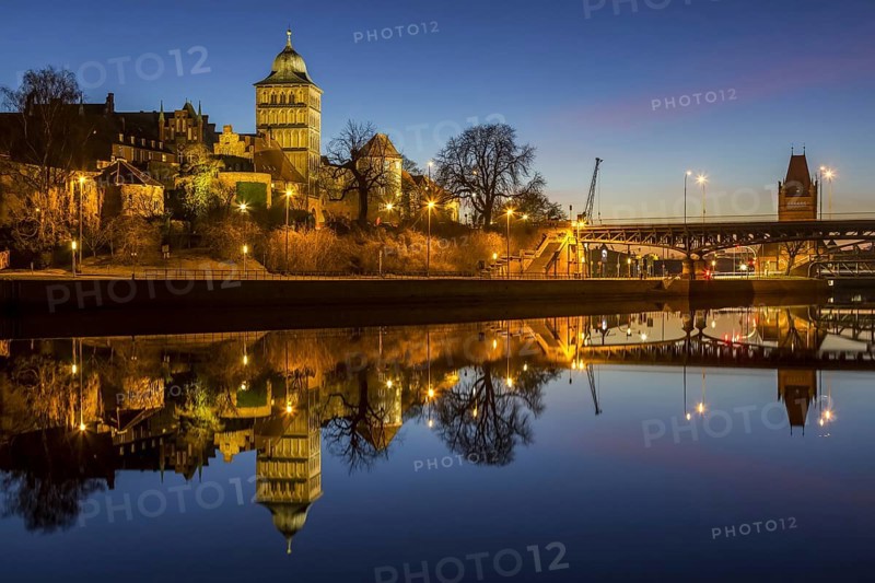 Gothic Burgtor Gate reflected in water of the Elbe Luebeck Canal