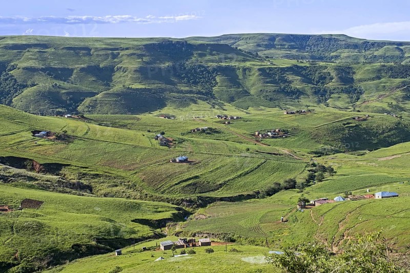 Drakensberg Mountain Range and rural settlement in the countryside of Injisuthi area in KwaZulu-Natal