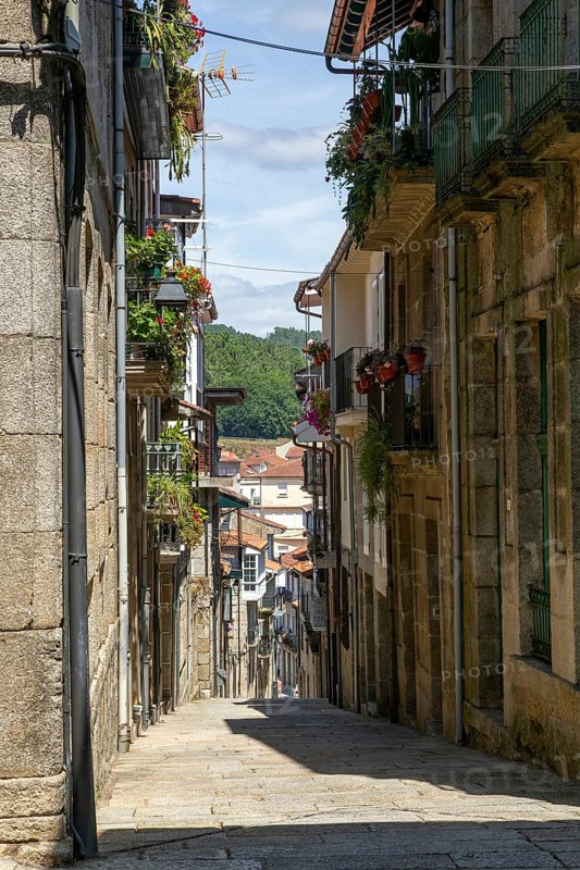 Houses on steep narrow street in medieval town