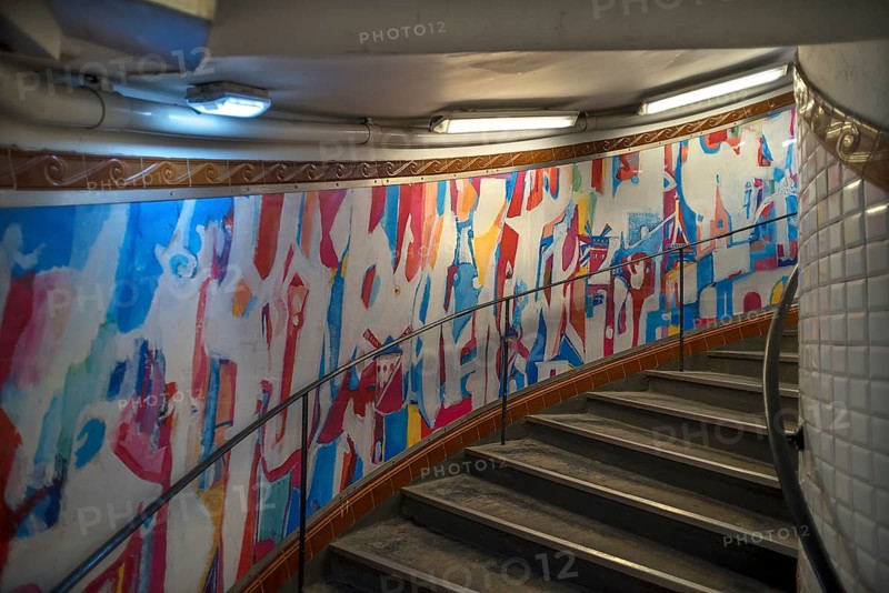Staircase in the Metro station Abbesses decorated with an abstract painting