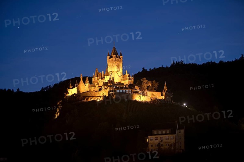 Illuminated Reichsburg Cochem in the evening