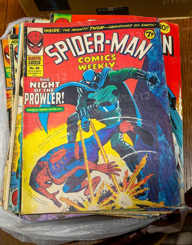 Box of Spider-Man comics on display in auction room