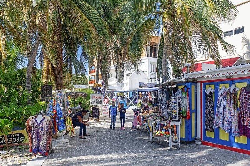 Souvenirs shop and palm trees along boulevard in the capital city Philipsburg of the Dutch island part of Sint Maarten