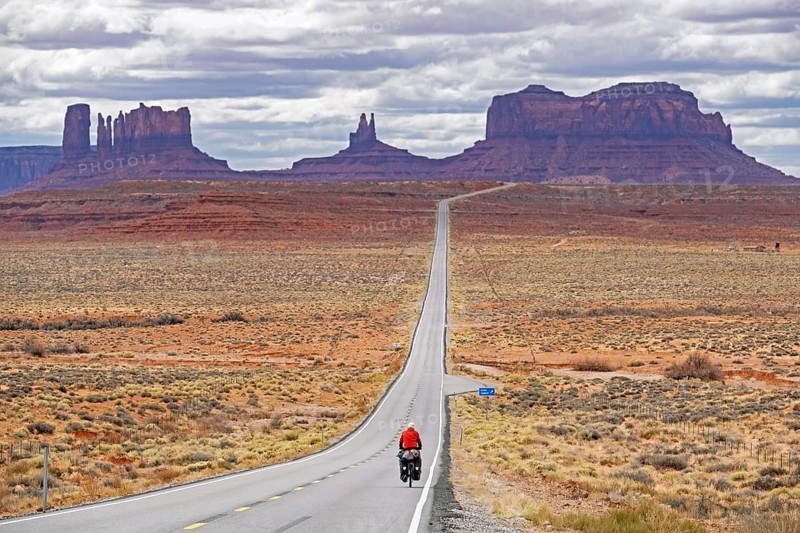 Forrest Gump Point and lonely cyclist on Highway 163 Scenic Drive