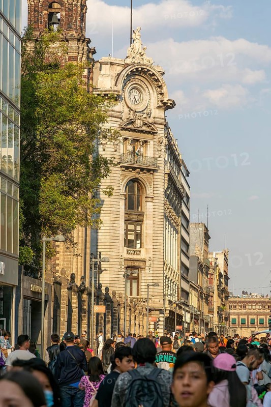 Crowd of people on pedestrianised street Avenida Madero