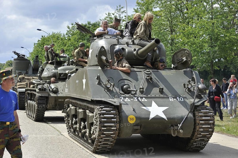 Second World War collectors on M4 Sherman battle tank during parade at the open day of the Belgian army at Leopoldsburg