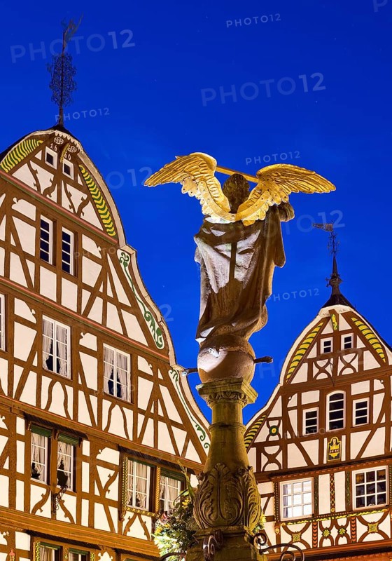 Gabled half-timbered houses with St. Michael's Fountain