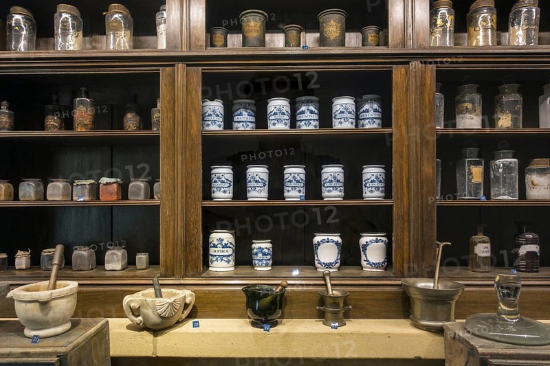 Antique pharmacy cabinet with vintage jars at the Orval Abbey