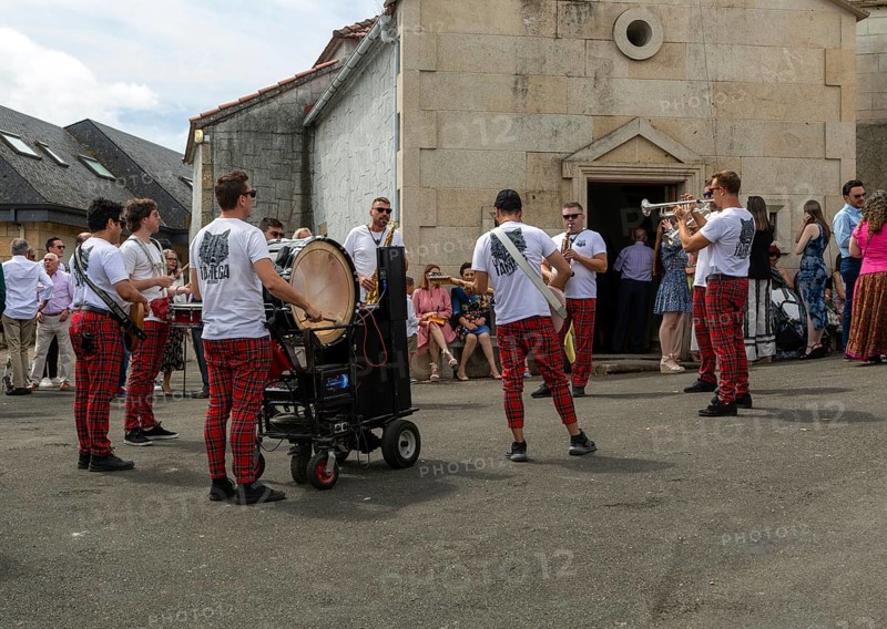 Village fiesta musicians and villagers outside chapel church