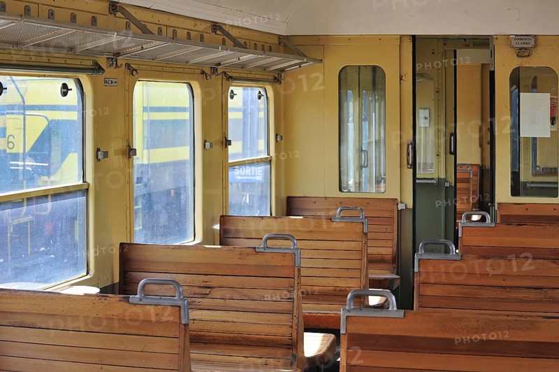 Old passenger carriage with wooden benches at the depot of the Chemin de Fer a Vapeur des Trois Vallees at Mariembourg