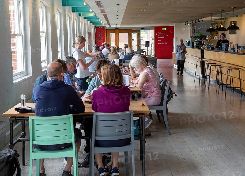 Customers sitting at cafe tables River View cafe bar