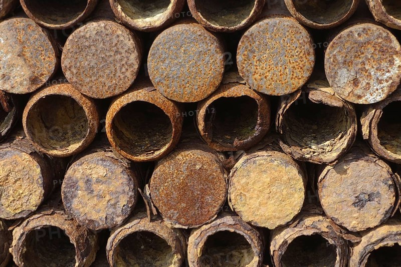Stacked rusty First World War One artillery grenade shells