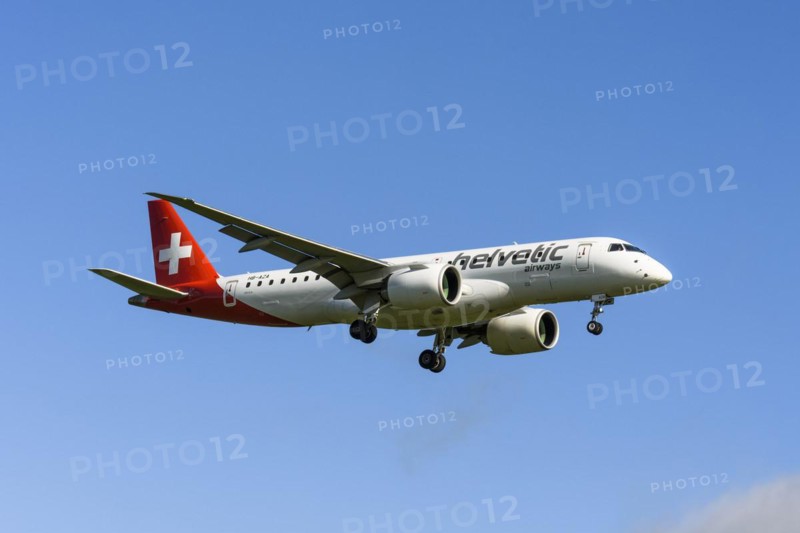 Helvetic Airways passenger aircraft Embraer E190-E2 on approach to Zurich airport