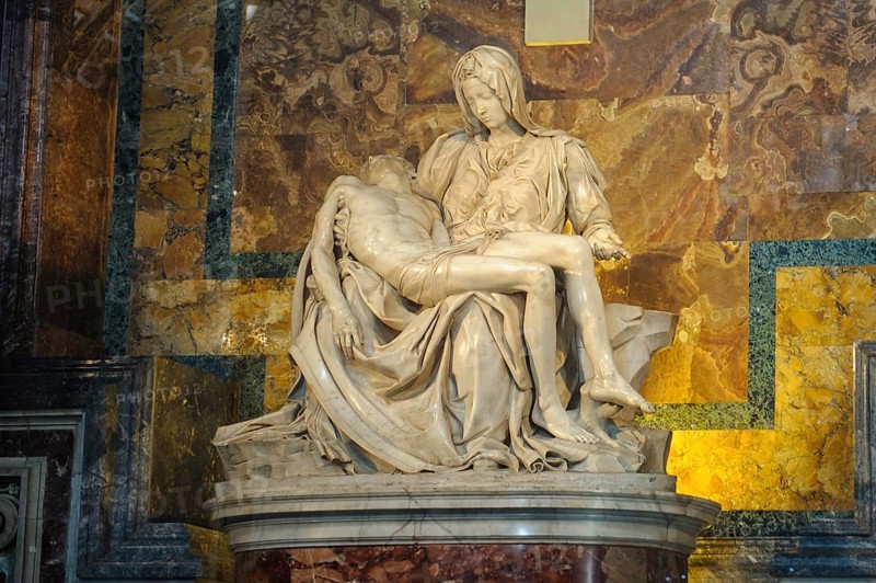 Marble sculpture Sculpture of white marble from Carrara in warm light Pieta by Michelangelo Mary Mother of God mourns holds son