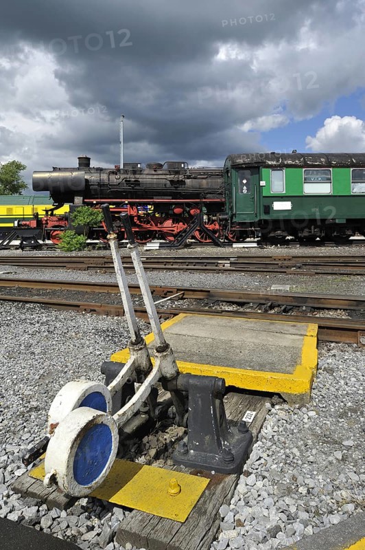 Steam train and track switch levers at the depot of the Chemin de Fer a Vapeur des Trois Vallees at Mariembourg