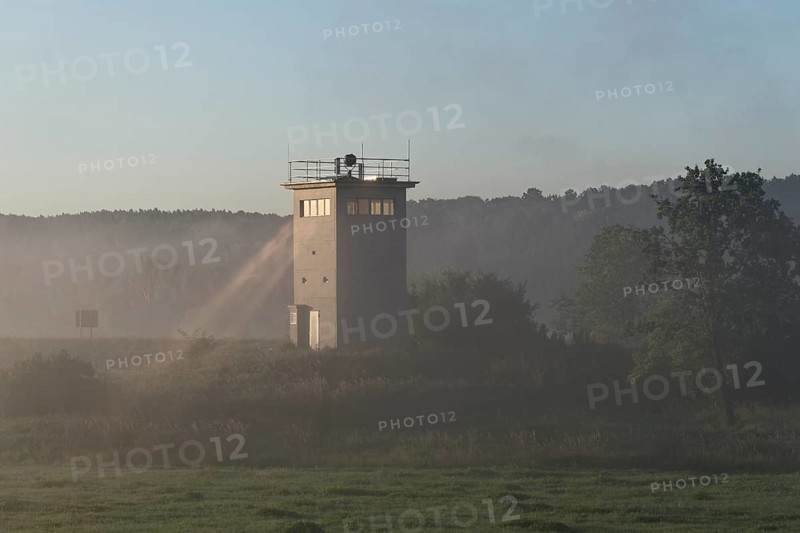 Former GDR border tower in the early morning mist in the Elbe floodplain near Darchau in the Elbe River Landscape UNESCO Biosphere Reserve. Amt Neuhaus