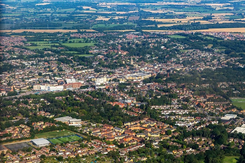 Oblique aerial view through plane window of Bishop's Stortford town