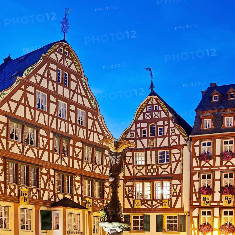 Gabled half-timbered houses on the medieval market square in the evening