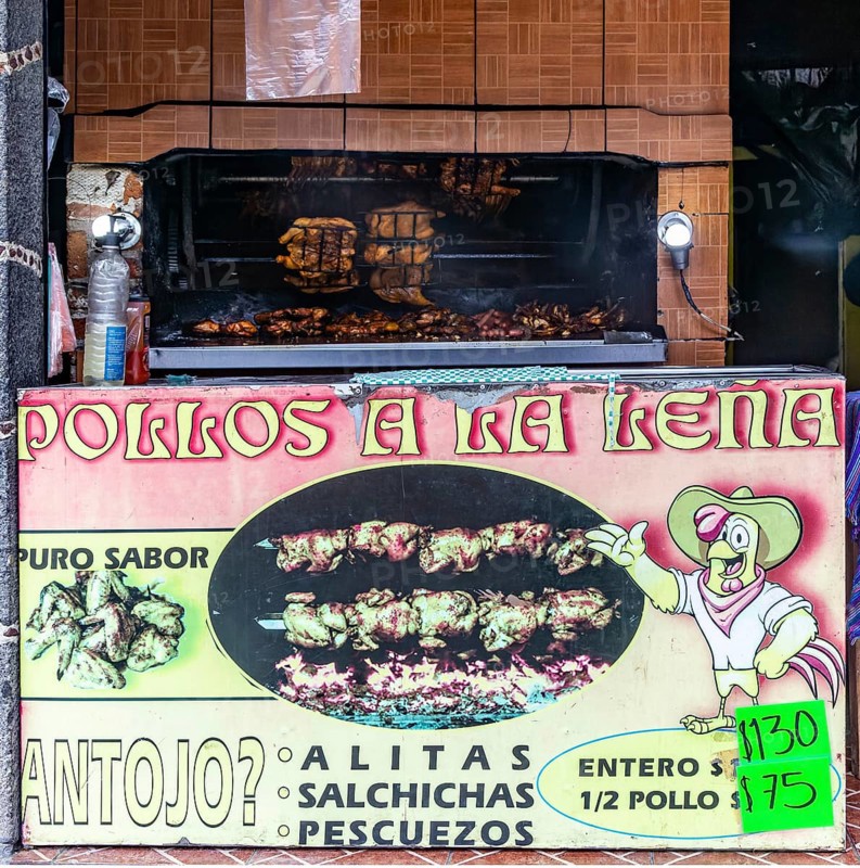Grilled chicken street cooking on rotary grill