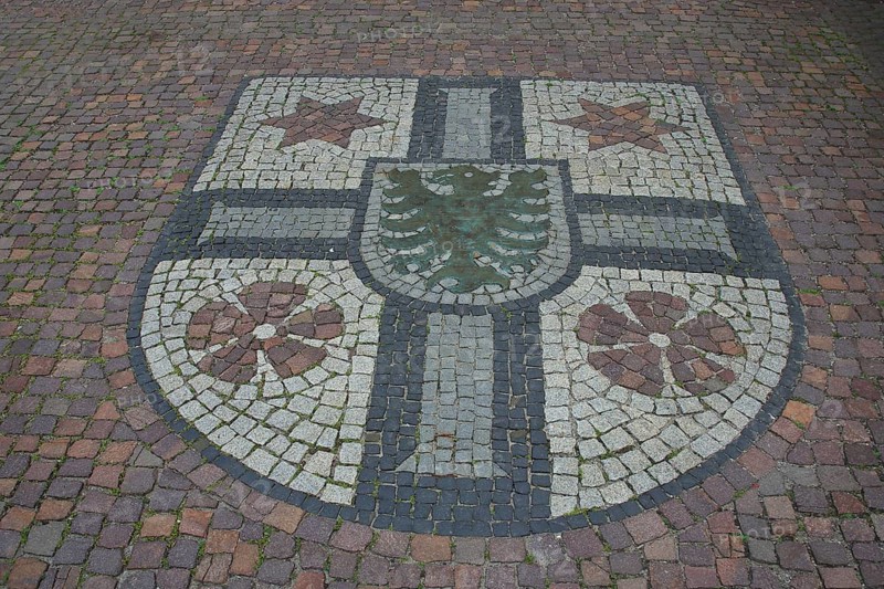 City coat of arms as a floor mosaic in front of the town hall