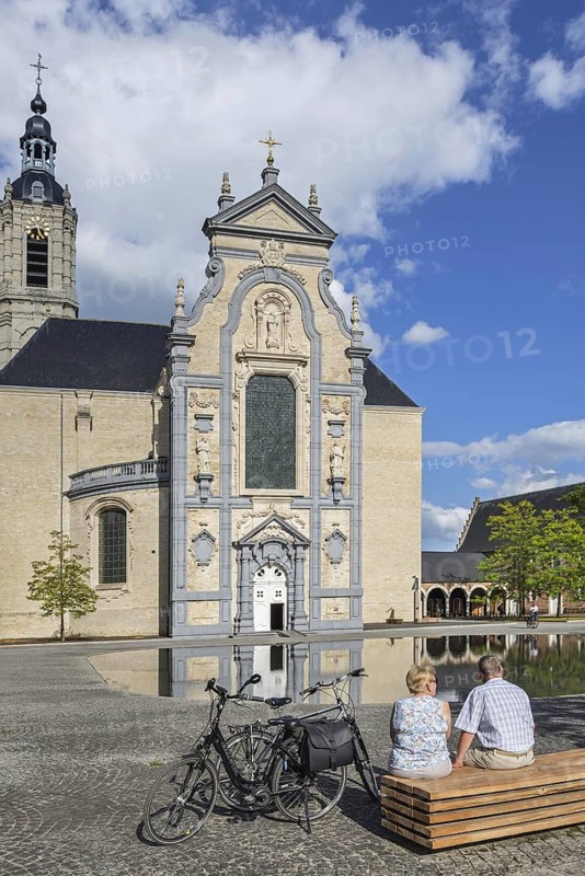 Cyclists resting in front of the 17th century Baroque church of the Averbode Abbey at Scherpenheuvel-Zichem