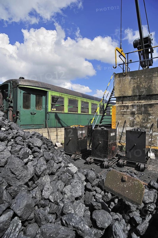 Crane and heap of coal as fuel for steam train at the depot of the Chemin de Fer a Vapeur des Trois Vallees at Mariembourg