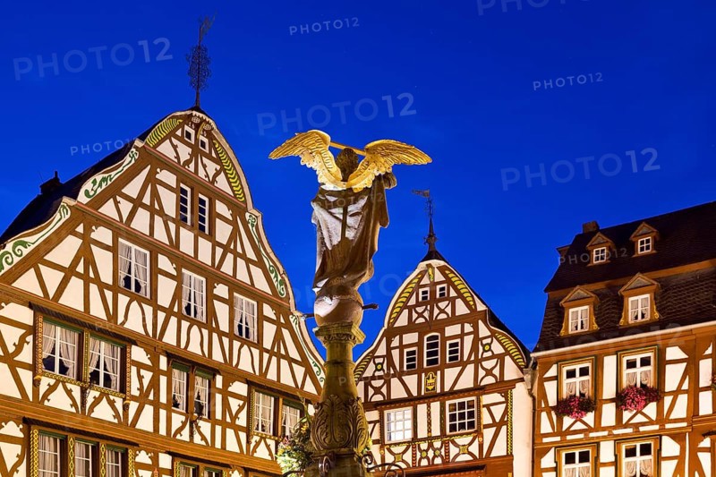 Gabled half-timbered houses with St. Michael's Fountain
