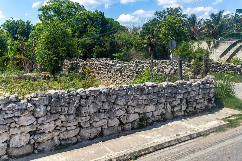 View from bus window of carboniferous limestone stone blocks in dry stone walls
