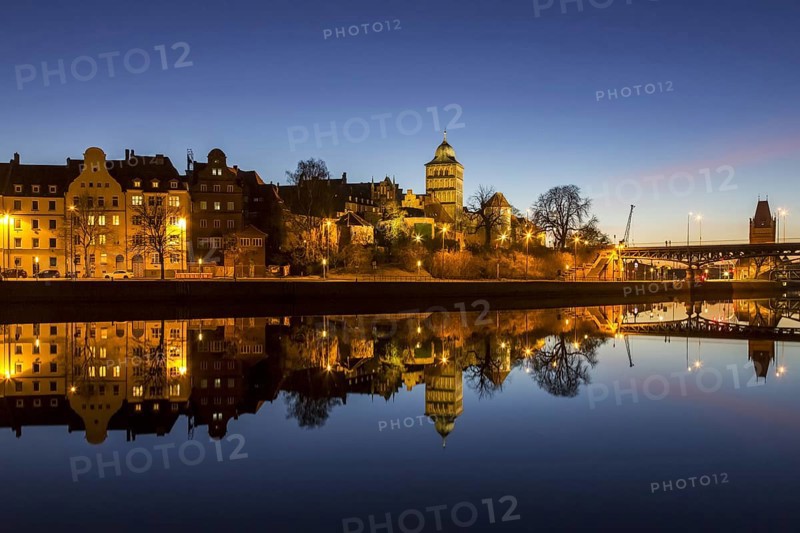 Gothic Burgtor Gate reflected in water of the Elbe Luebeck Canal