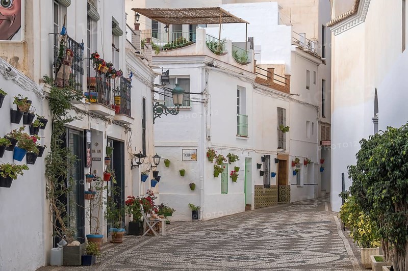 Alley with white houses