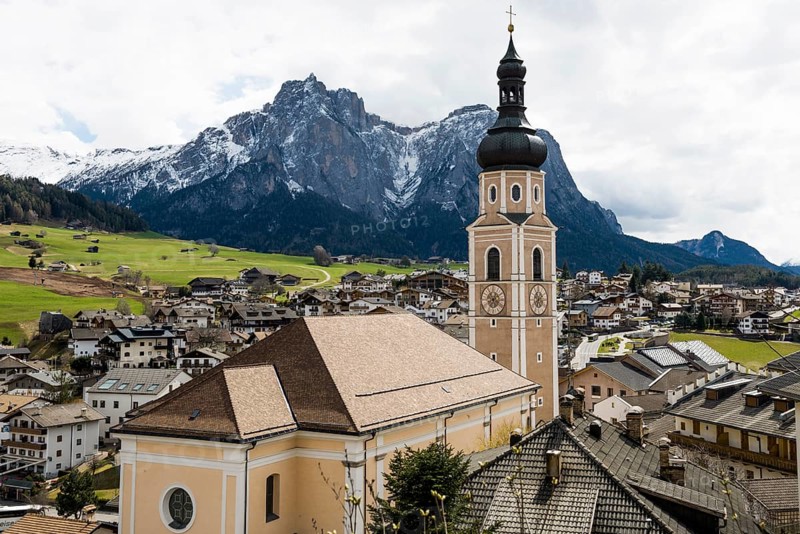 Village and snow-capped mountains