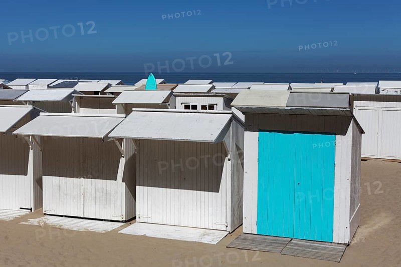 Uniform white beach huts