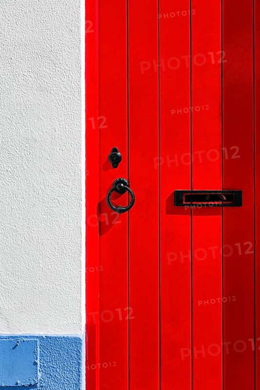Red wooden door with fittings
