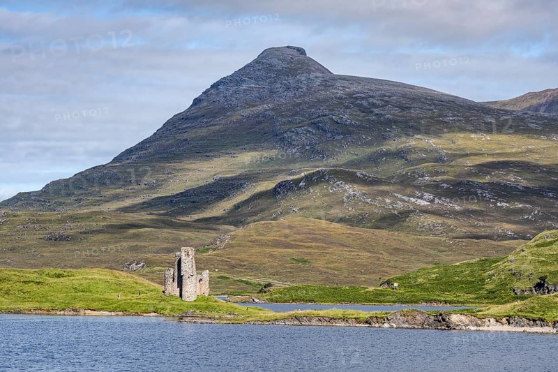 The ruins of Ardvreck Castle on a peninsula by the loch of Loch Assynt