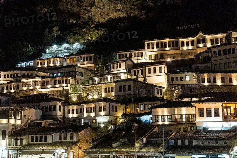 Detail of the beautiful houses of the illuminated historical city of Berat in Albania
