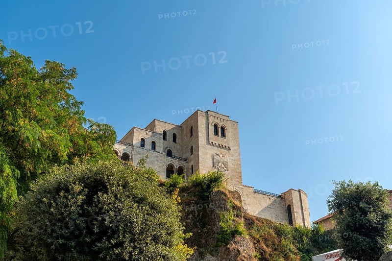 View from below of Kruje Castle and its fortress with the walls. Albania