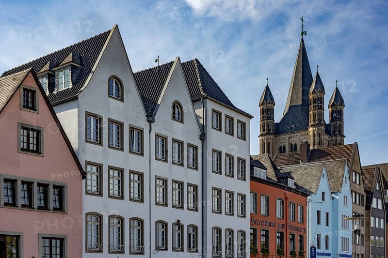 Gabled houses in the old town of Cologne at the Fischmarkt and the church Gross St. Martin
