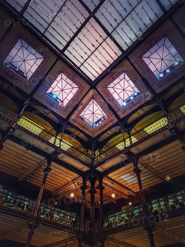 Architectural details of the glowing glass ceiling inside the Museum of Natural History
