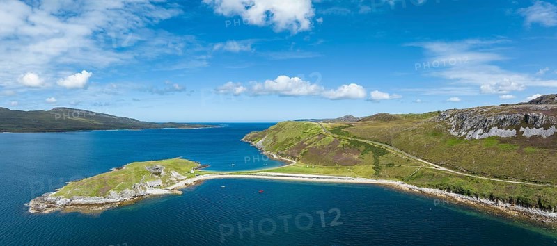 Aerial panorama of the Ard Neaki peninsula in the sea loch of Loch Eribol with the abandoned lime kilns and ferry house