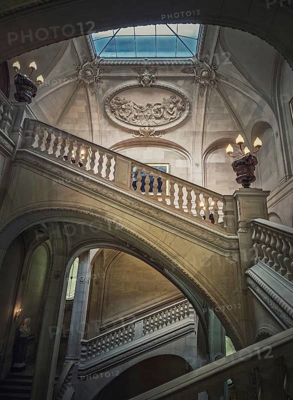 Louvre Palace architectural details of a hall with stone staircase